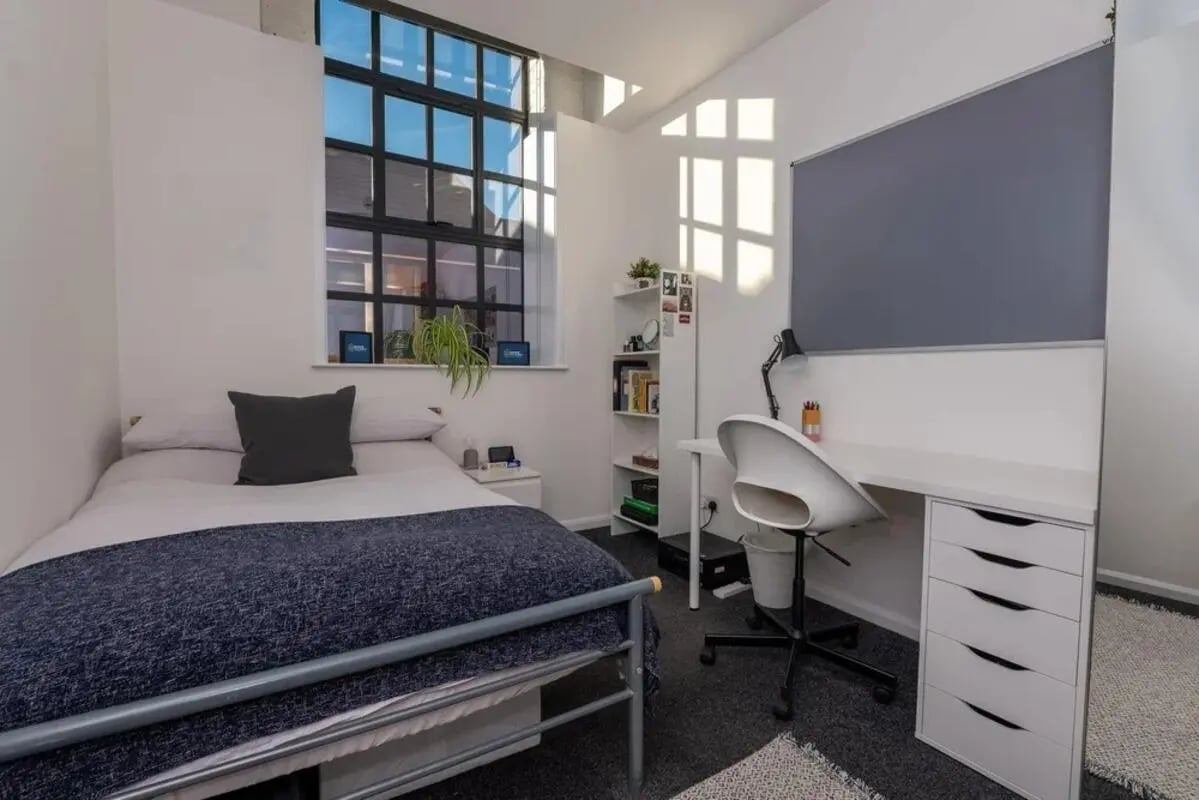 Bed desk chair shelving whiteboard bedroom at Bertrand Russell House in Nottingham Student Accommodation
