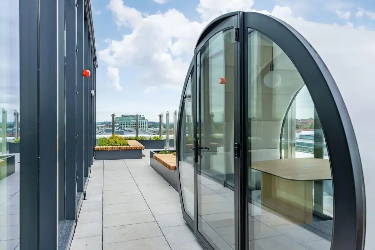 Glass pod with desk on rooftop balcony exterior at The Place in Nottingham Student Accommodation