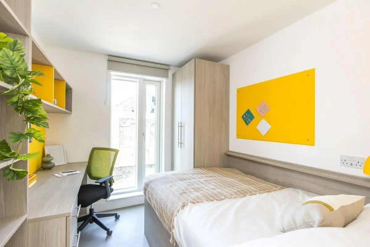 Bed desk chair and wardrobe bedroom at Timber Yard in Bristol Student Accommodation