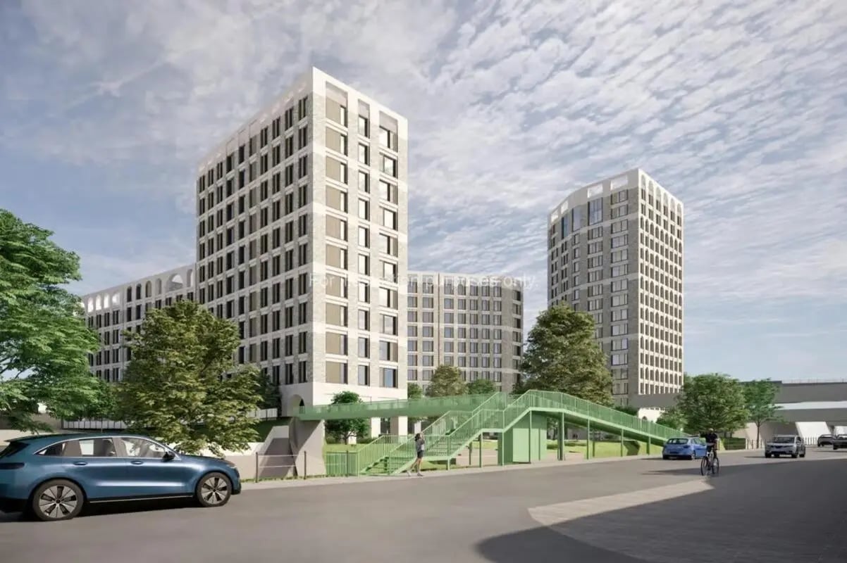 Modern apartment buildings with green pedestrian bridge exterior at Timber Yard in Bristol Student Accommodation
