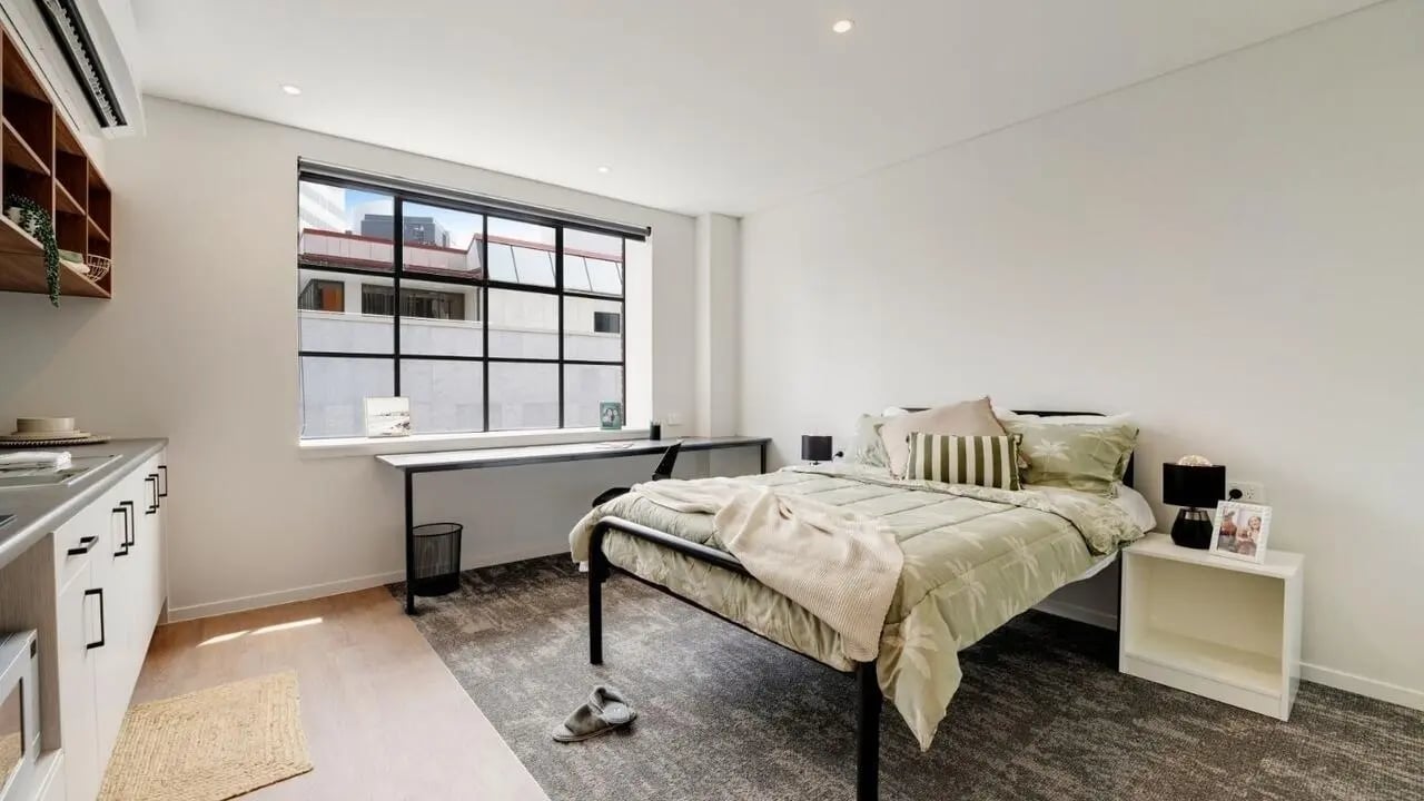 Bed desk and kitchen counter bedroom at UniLodge Auckland Central in Auckland Student Accommodation