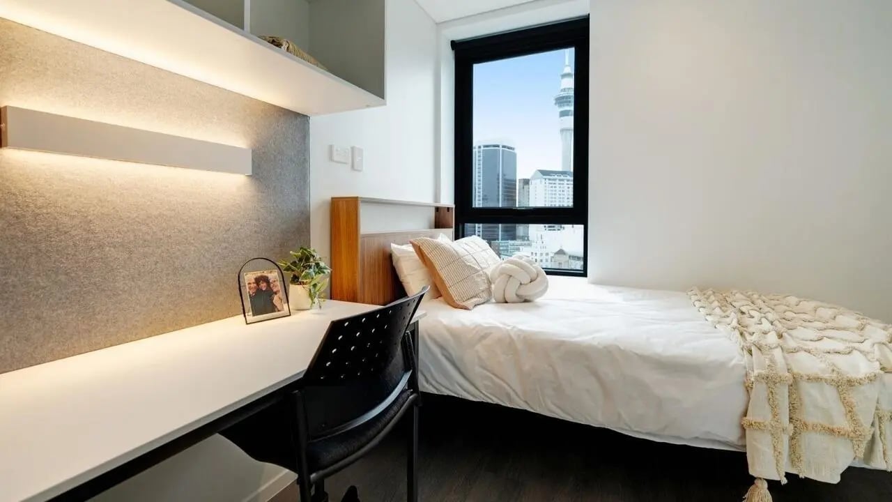 Bed desk chair and window Bedroom at UniLodge Auckland Central in Auckland Student Accommodation
