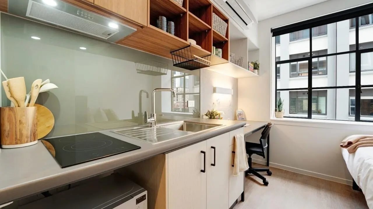 Kitchenette with bed and desk studio at UniLodge Auckland Central in Auckland Student Accommodation