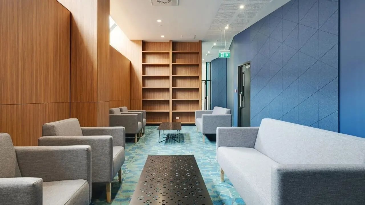 Sofa armchairs bookshelves coffee tables communal area at UniLodge Auckland Central in Auckland Student Accommodation