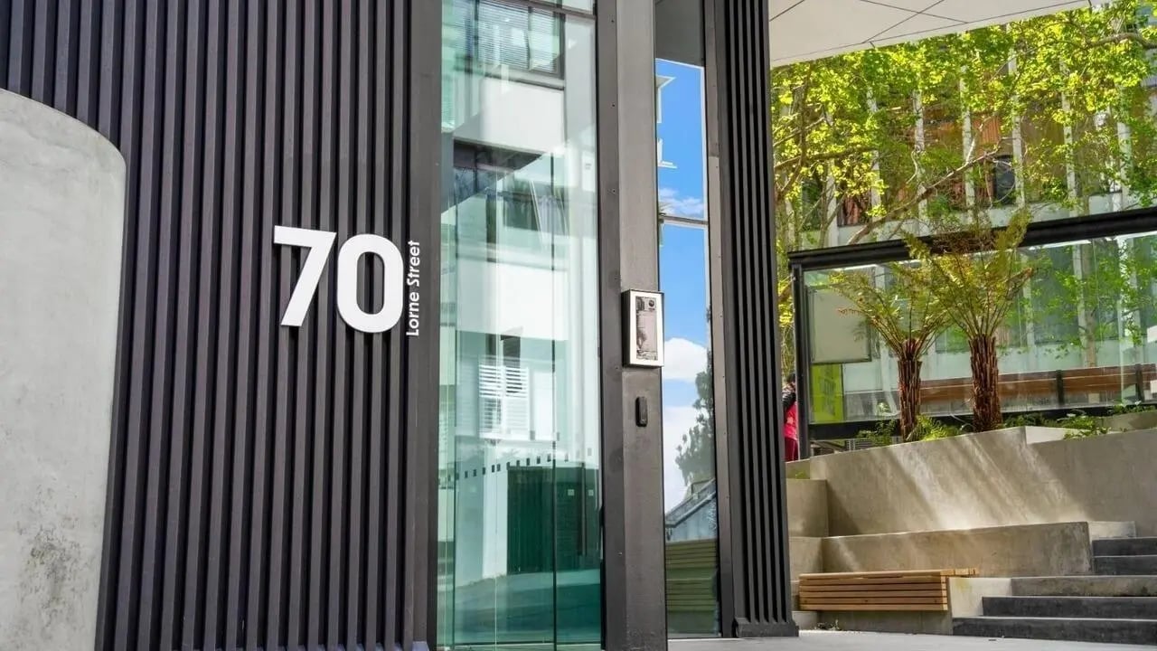 Building entrance with number 70 and Lorne Street sign exterior at UniLodge Auckland Central in Auckland Student Accommodation