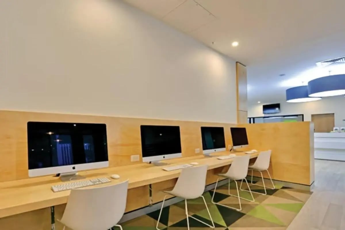 Row of computers chairs and desks study area at Scape Sydney Central in Sydney Student Accommodation