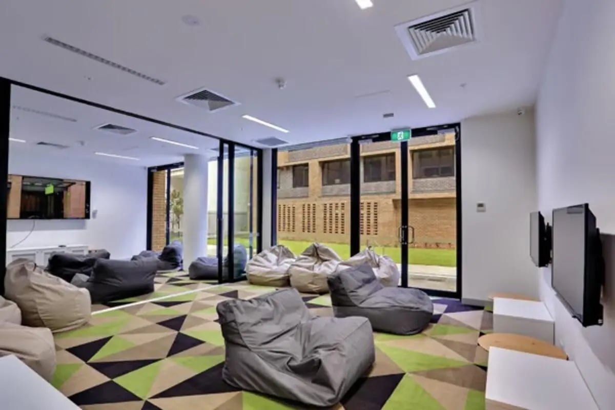 Beanbags television on wall modern lounge living room at Scape Sydney Central in Sydney Student Accommodation