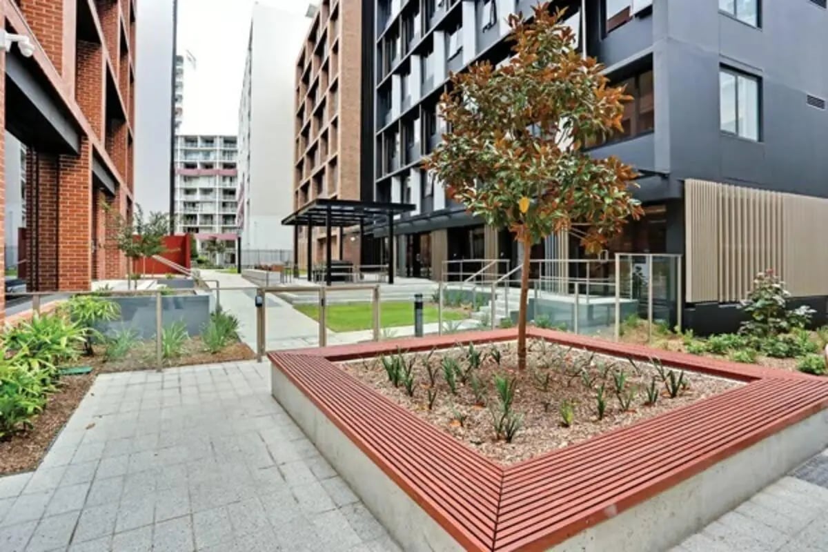 Modern student housing with outdoor seating and landscaping exterior at Scape Sydney Central in Sydney Student Accommodation