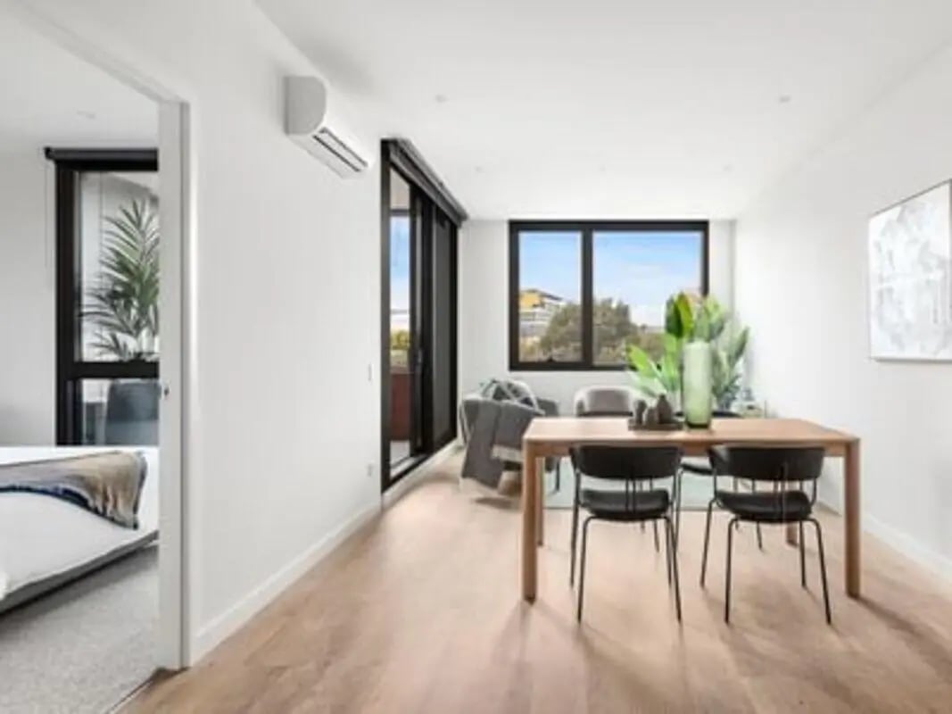 Dining table chairs and air conditioner living area at Caulfield Place in Melbourne Student Accommodation