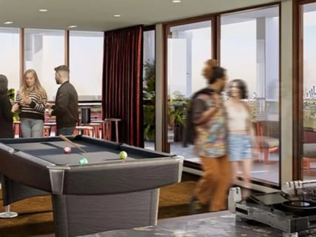 Pool table people red curtains game room at Caulfield Place in Melbourne Student Accommodation