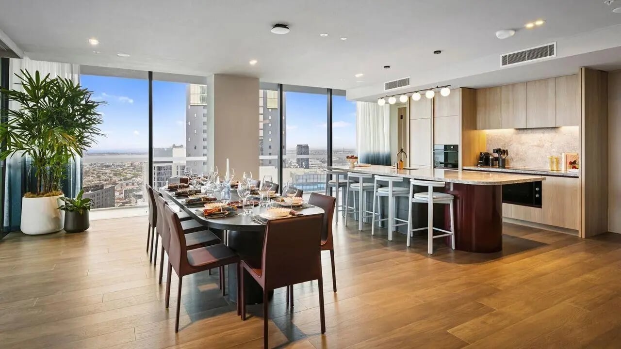 Dining table and kitchen island dining area at Indi South Bank in Melbourne Student Accommodation