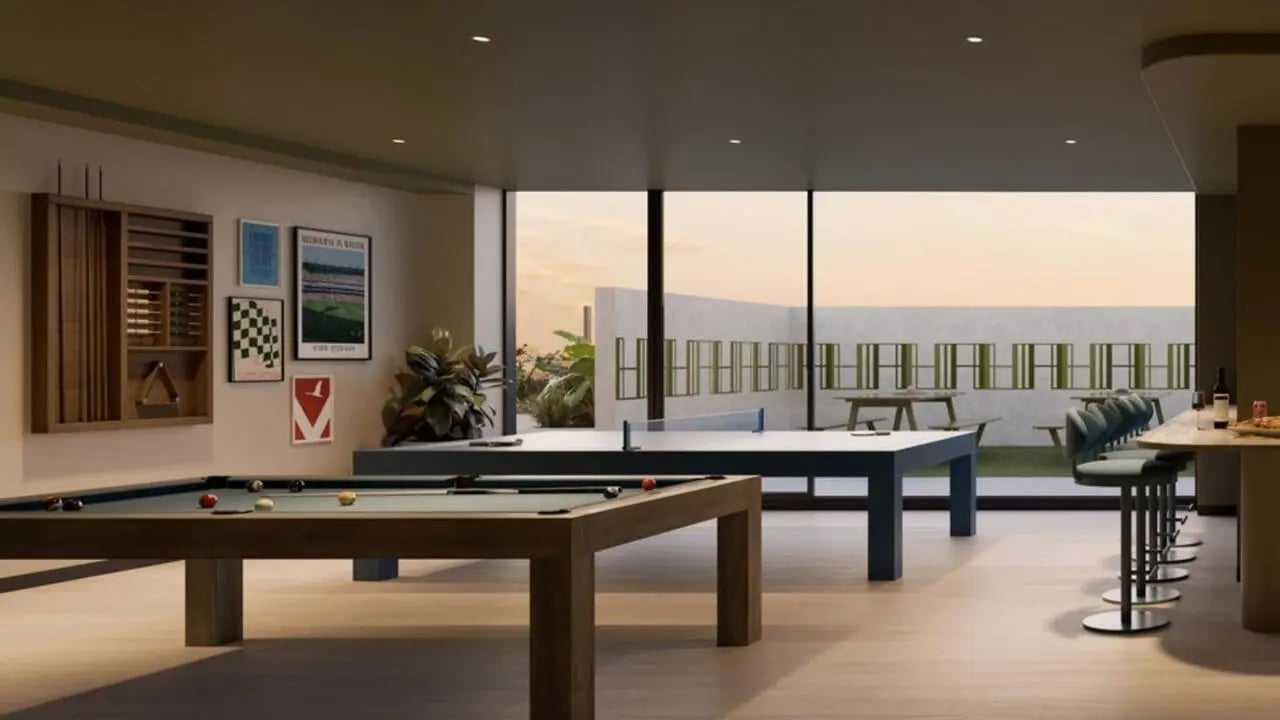 Billiard table ping pong table bar stools lounge area at The Archive - Residential Living in Melbourne Student Accommodation