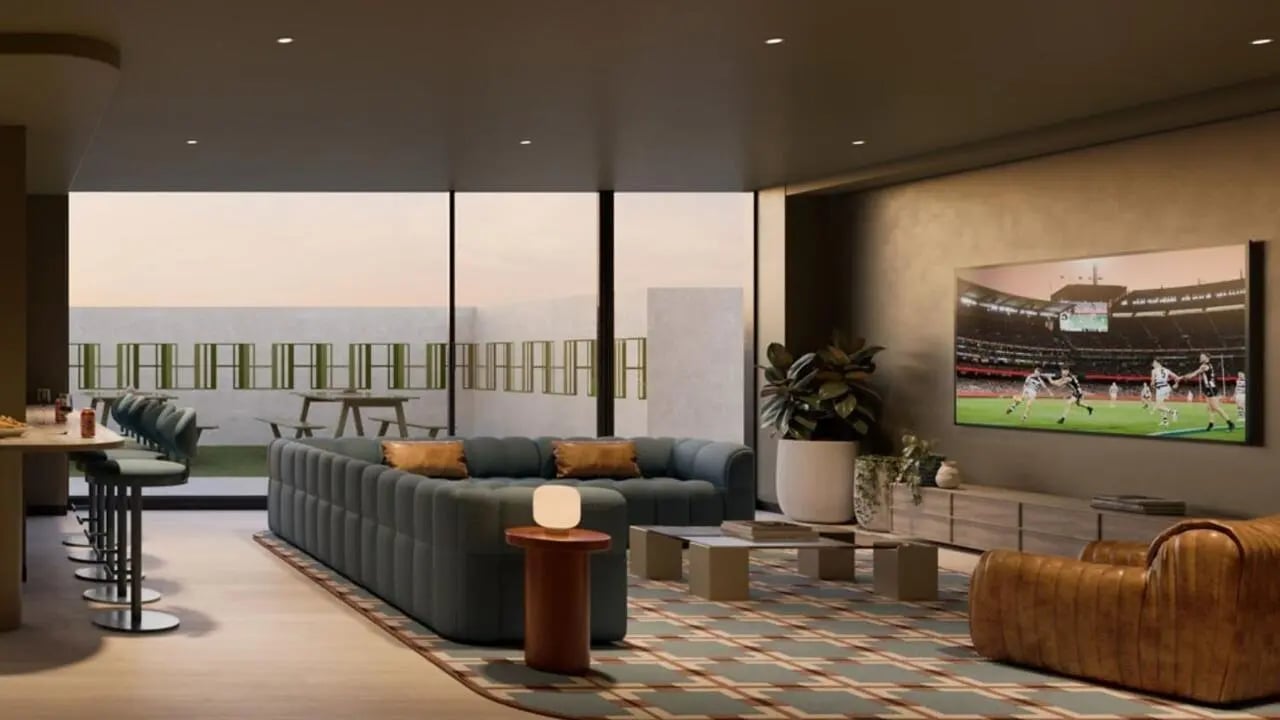 Sofa TV bar stools and table living room at The Archive - Residential Living in Melbourne Student Accommodation