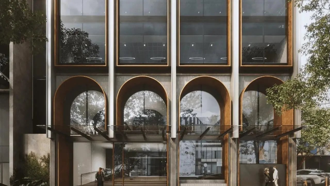 Modern building with arched windows and trees exterior at The Archive - Residential Living in Melbourne Student Accommodation