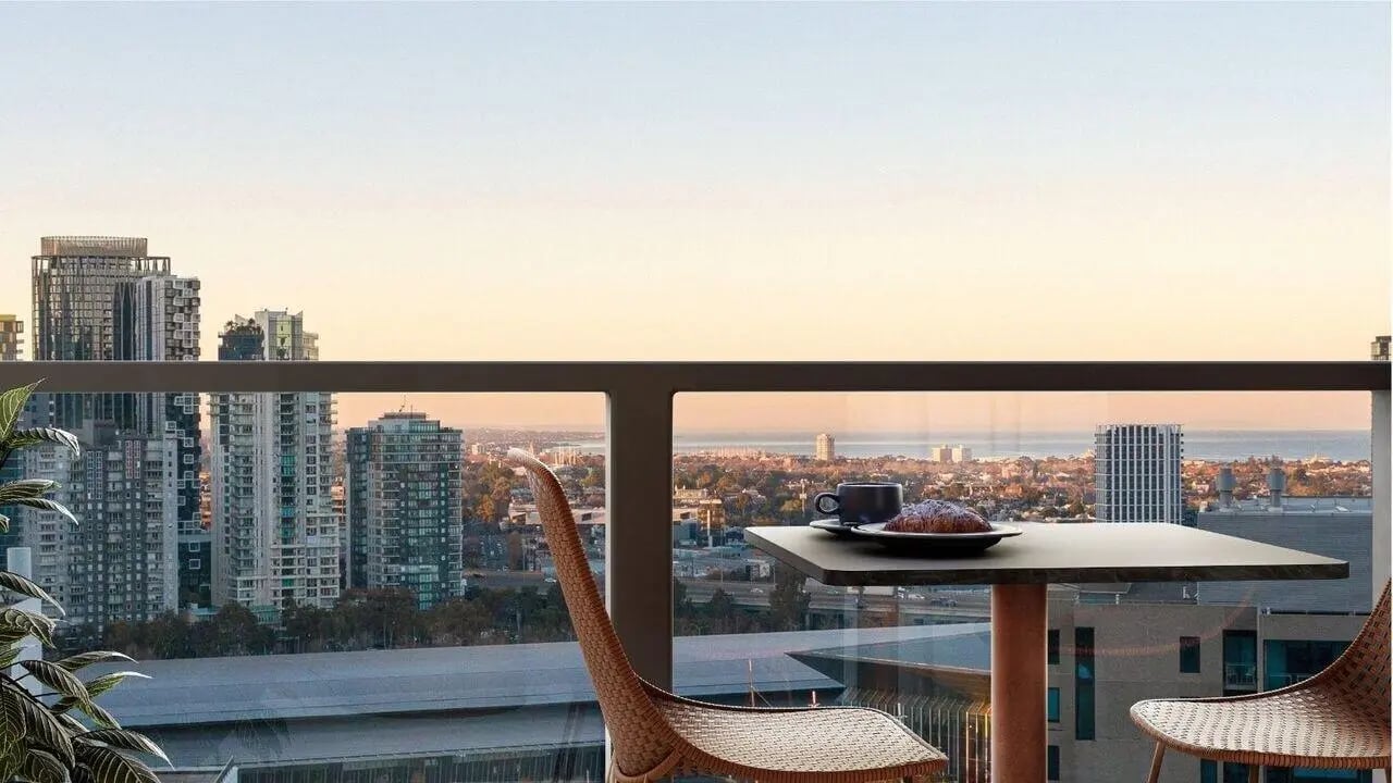 Table chairs coffee and croissant balcony view at West Tower, Melbourne Quarter in Melbourne Student Accommodation