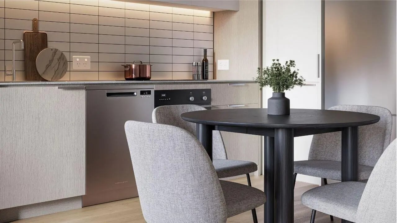 Modern kitchen with dishwasher oven and dining table kitchen at West Tower, Melbourne Quarter in Melbourne Student Accommodation
