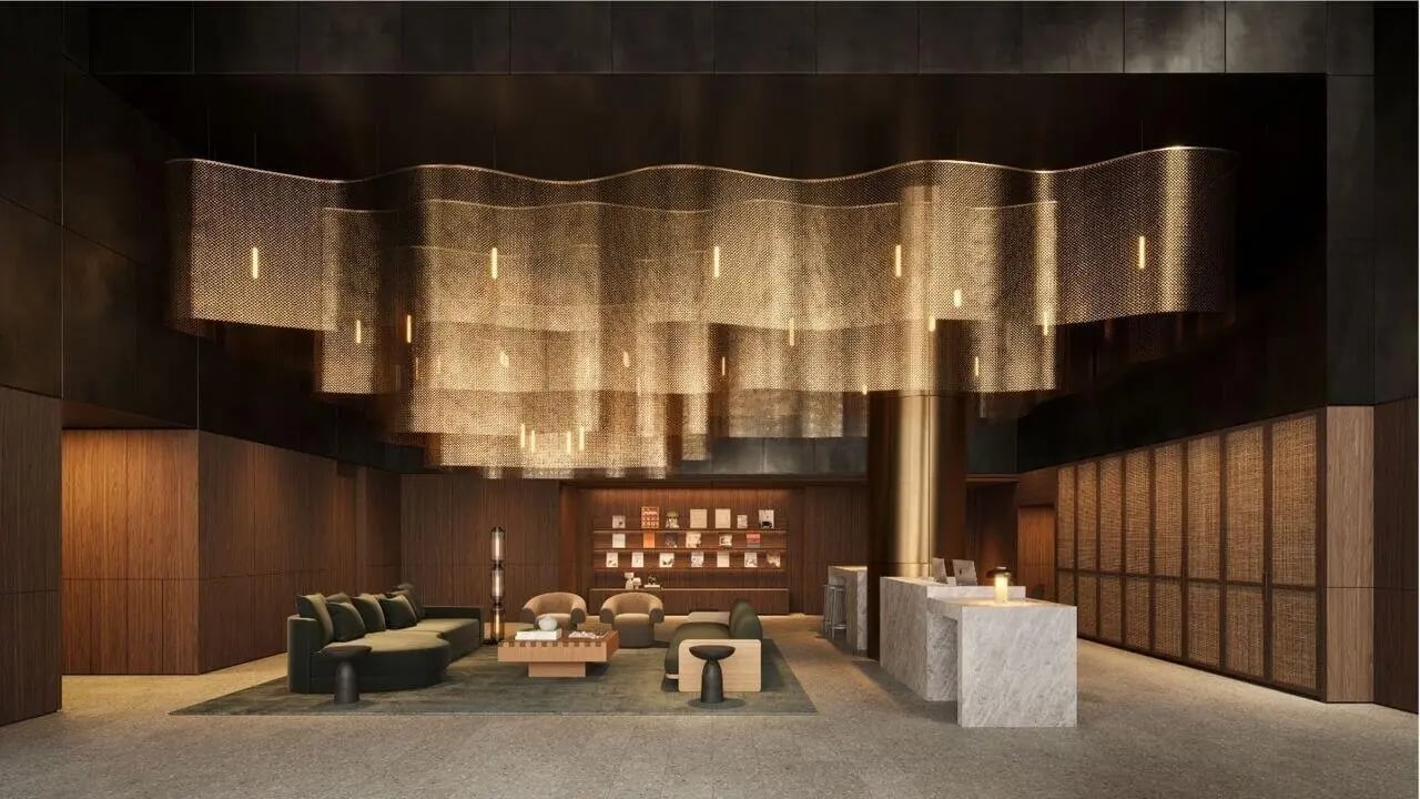 Modern lounge with sofas and reception desk living room at West Tower, Melbourne Quarter in Melbourne Student Accommodation