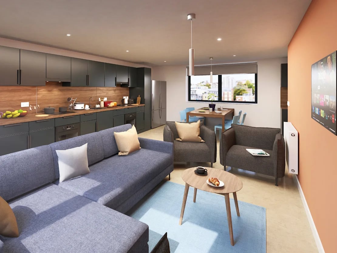 Sofa kitchen island chairs dining table living room at Croft Court in Bristol Student Accommodation