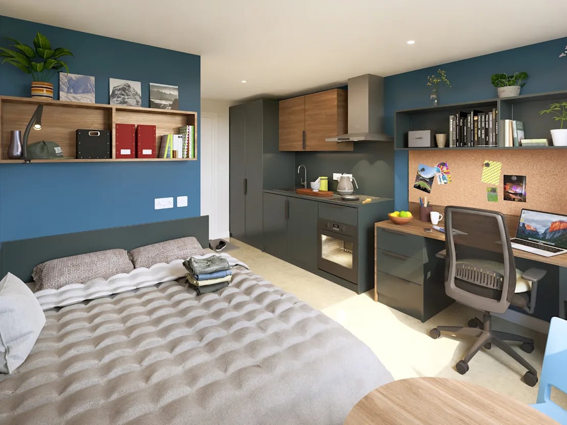 Bed kitchen desk and chair studio apartment at Croft Court in Bristol Student Accommodation