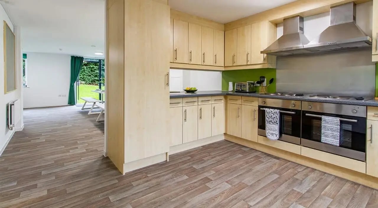 Kitchen with light wood cabinets ovens and hoods kitchen at The Green in Bradford Student Accommodation