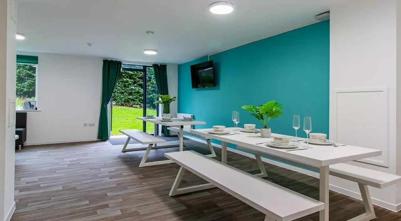 White tables benches dining set kitchen at The Green in Bradford Student Accommodation