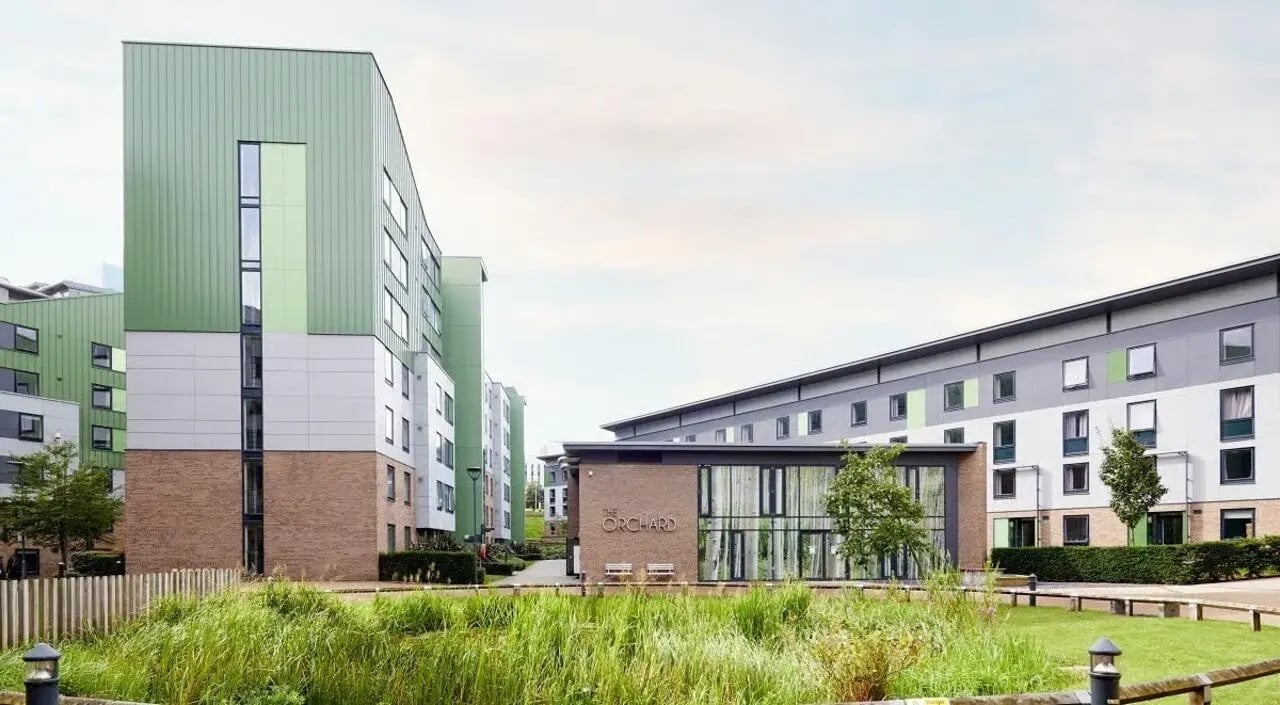 Modern student accommodation buildings with grass exterior at The Green in Bradford Student Accommodation