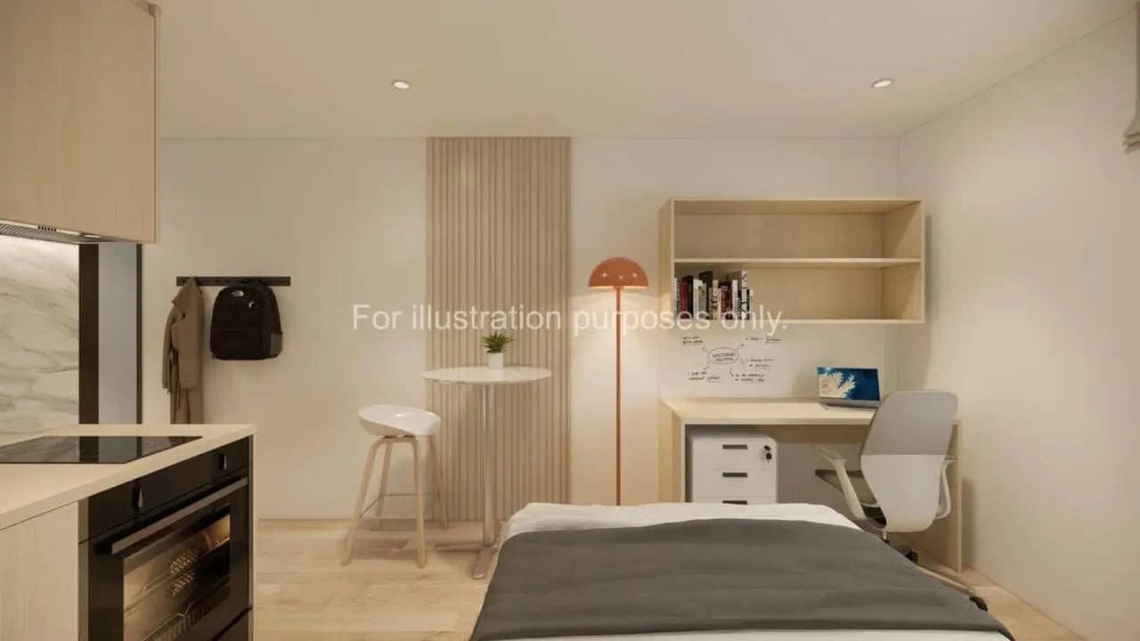Bed desk lamp shelving kitchen and study area at Stellaris in Cambridge Student Accommodation