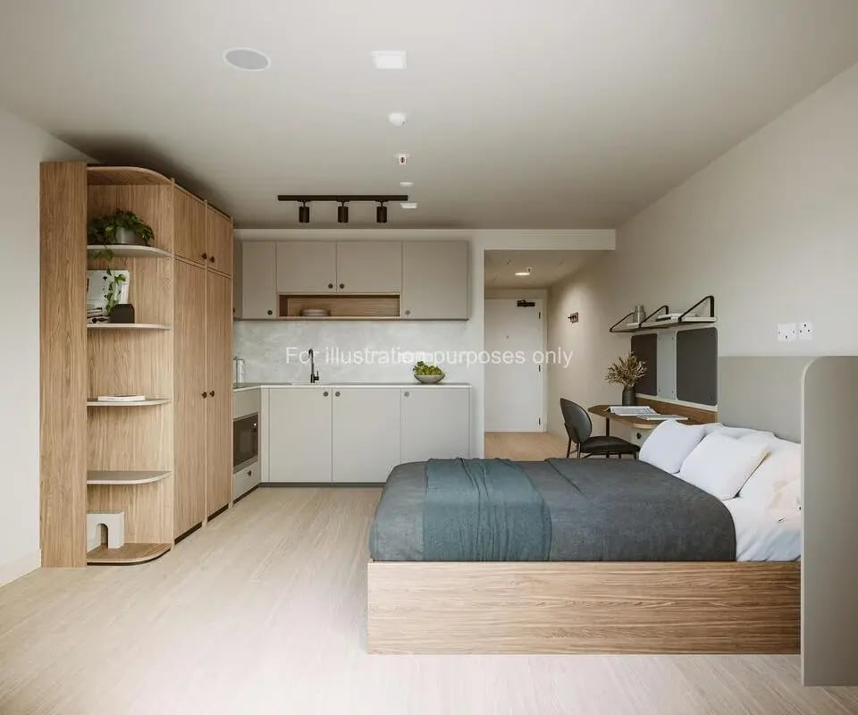 Bed kitchen desk and wardrobe studio apartment at Press House in London Student Accommodation