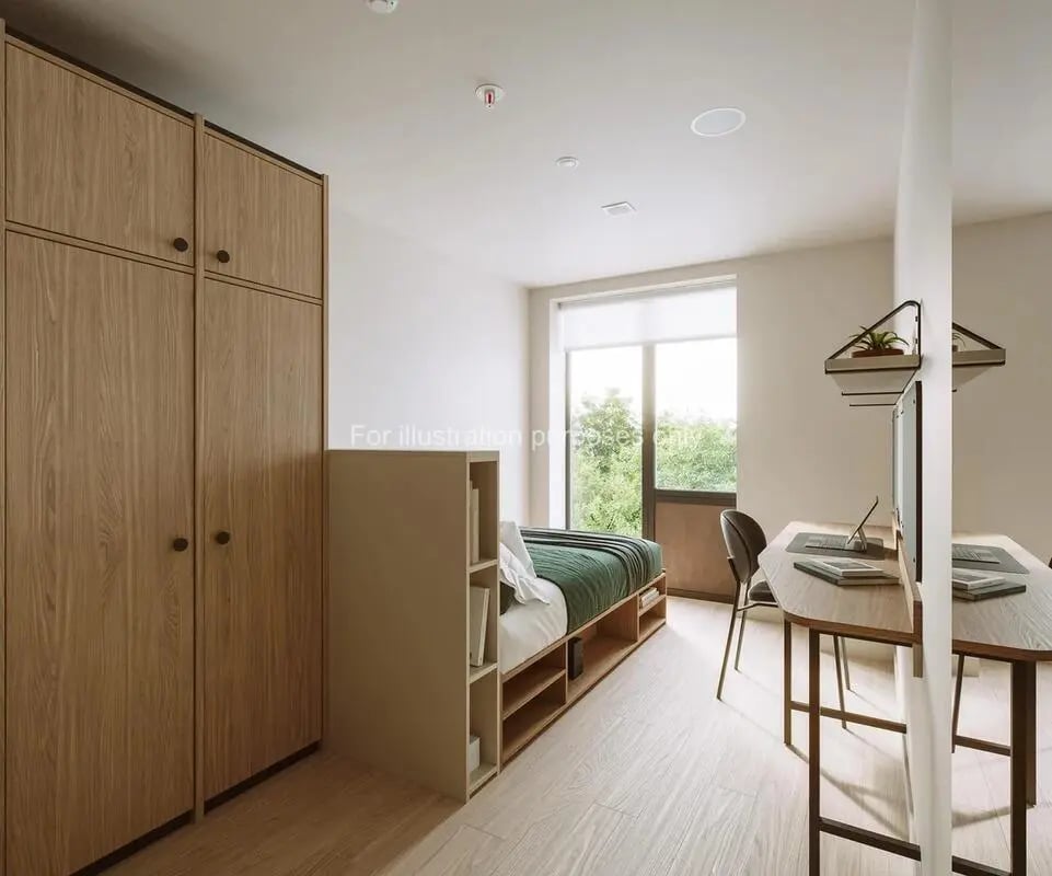 Bed desk wardrobe and window student room at Press House in London Student Accommodation