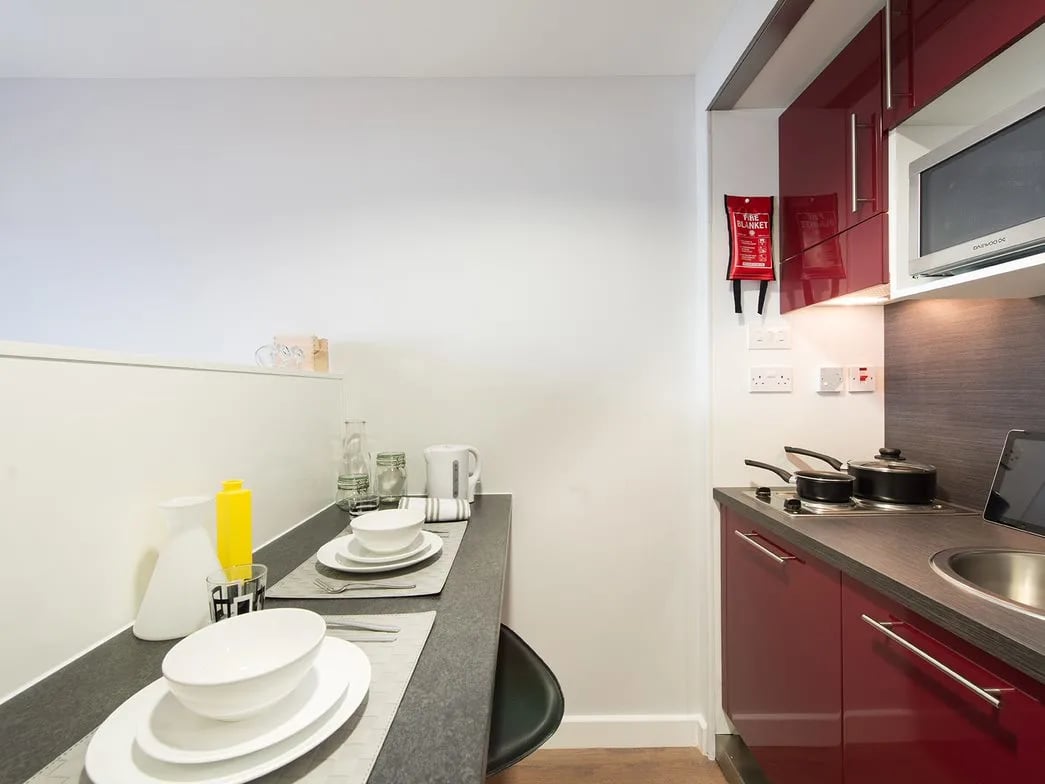 Dishes kettle fire blanket pots microwave kitchen at Glassyard Building in London Student Accommodation