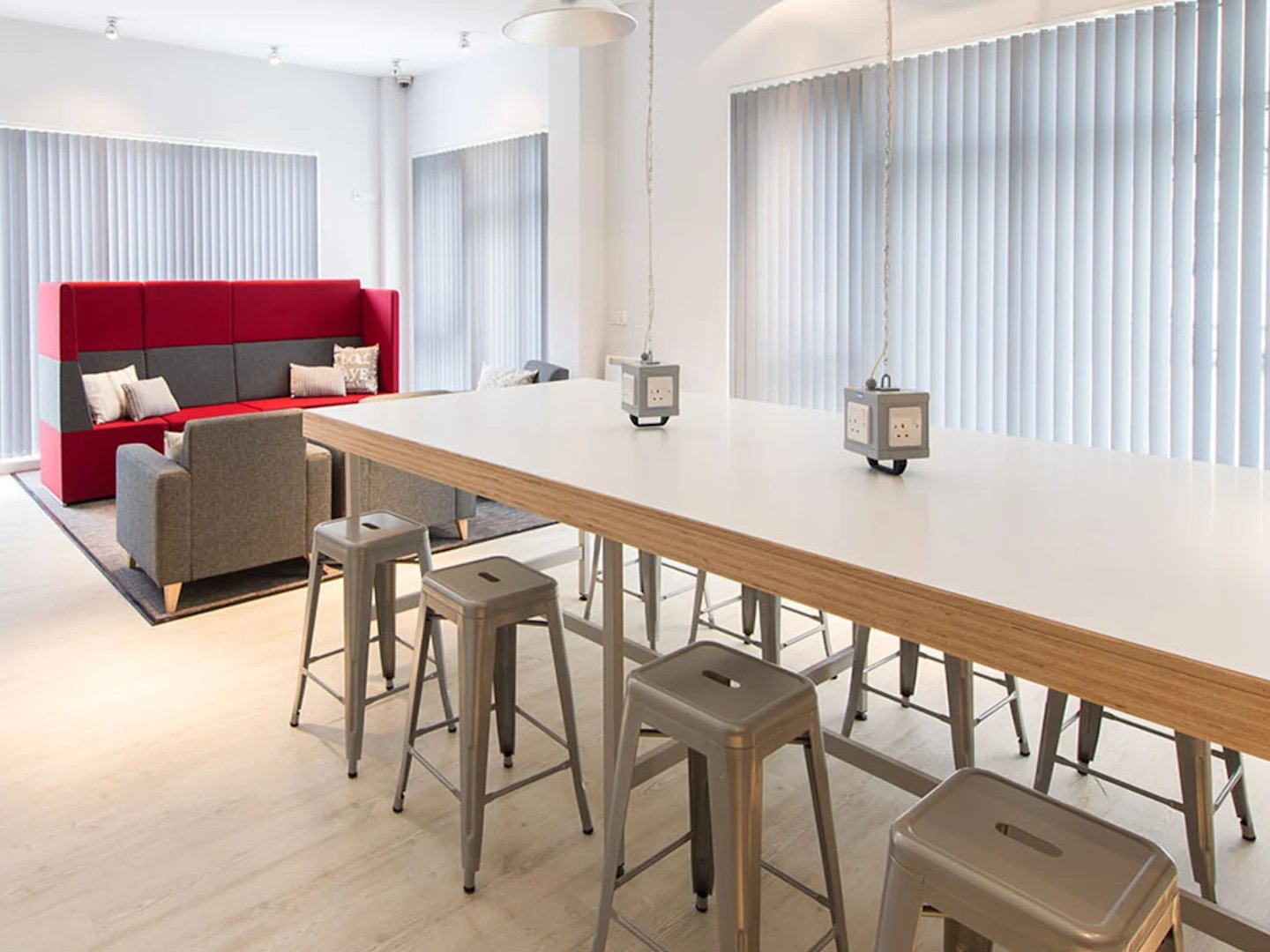 Communal area with long table sofa chairs study area at Glassyard Building in London Student Accommodation