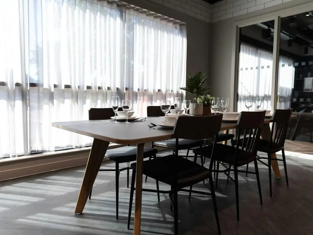 Dining table set with place settings and plant dining area at Stanley Studios - Portsmouth in Portsmouth Student Accommodation