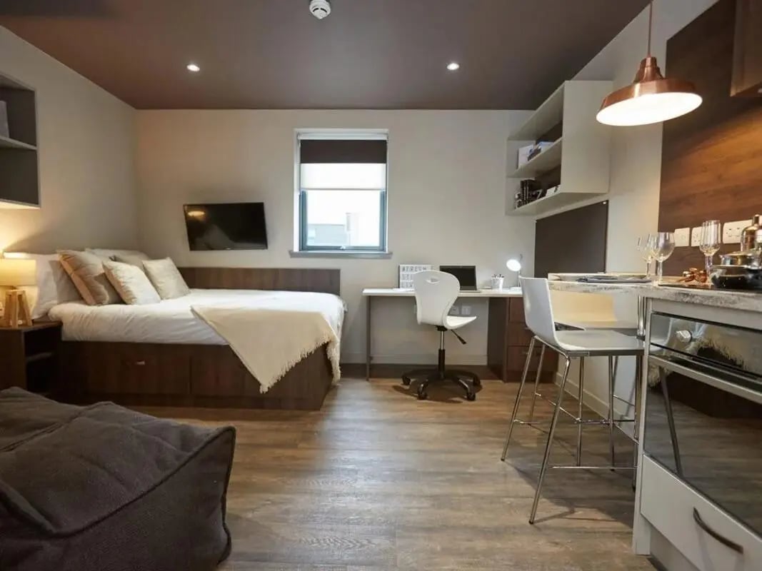 Bed desk TV kitchen area studio apartment at Woodside House in Glasgow Student Accommodation
