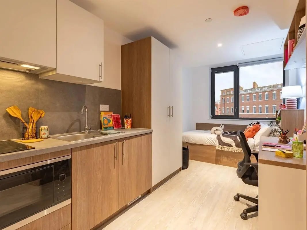 Kitchenette bed desk and wardrobe studio apartment at Glassworks in Bristol Student Accommodation