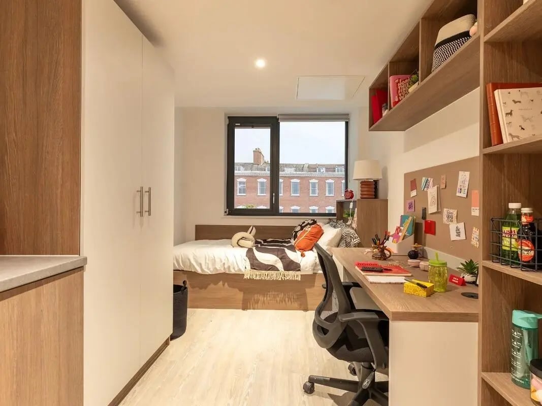 Bed desk and storage modern student accommodation bedroom at Glassworks in Bristol Student Accommodation