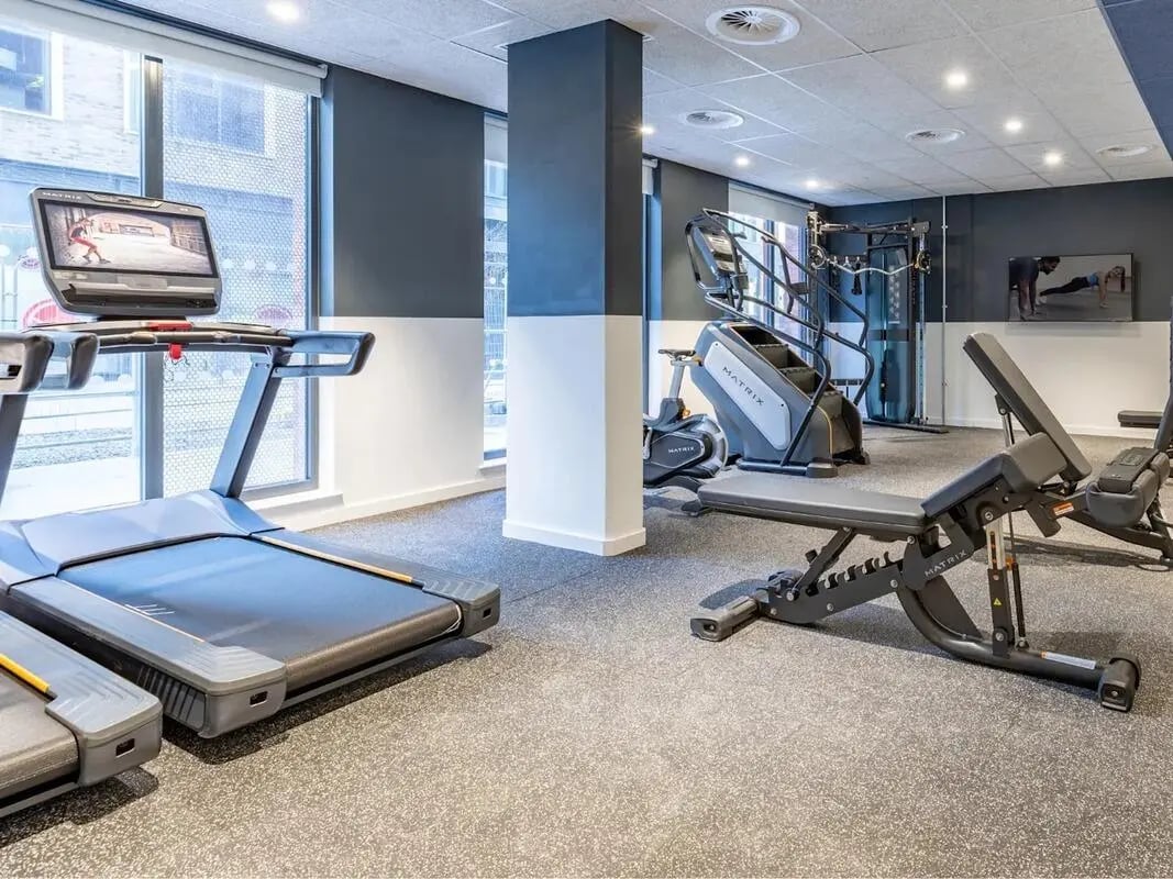 Treadmills stair climber exercise benches gym area at Glassworks in Bristol Student Accommodation