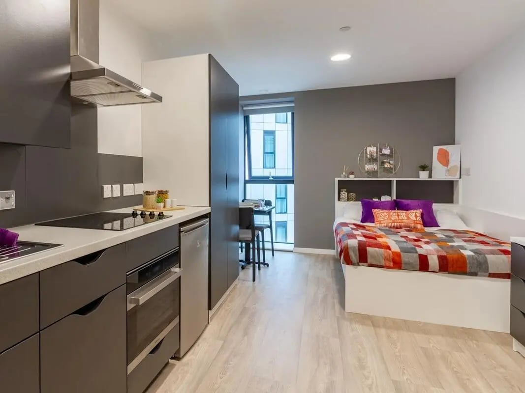 Bed kitchen and study area studio apartment at Pavilion Court London in London Student Accommodation
