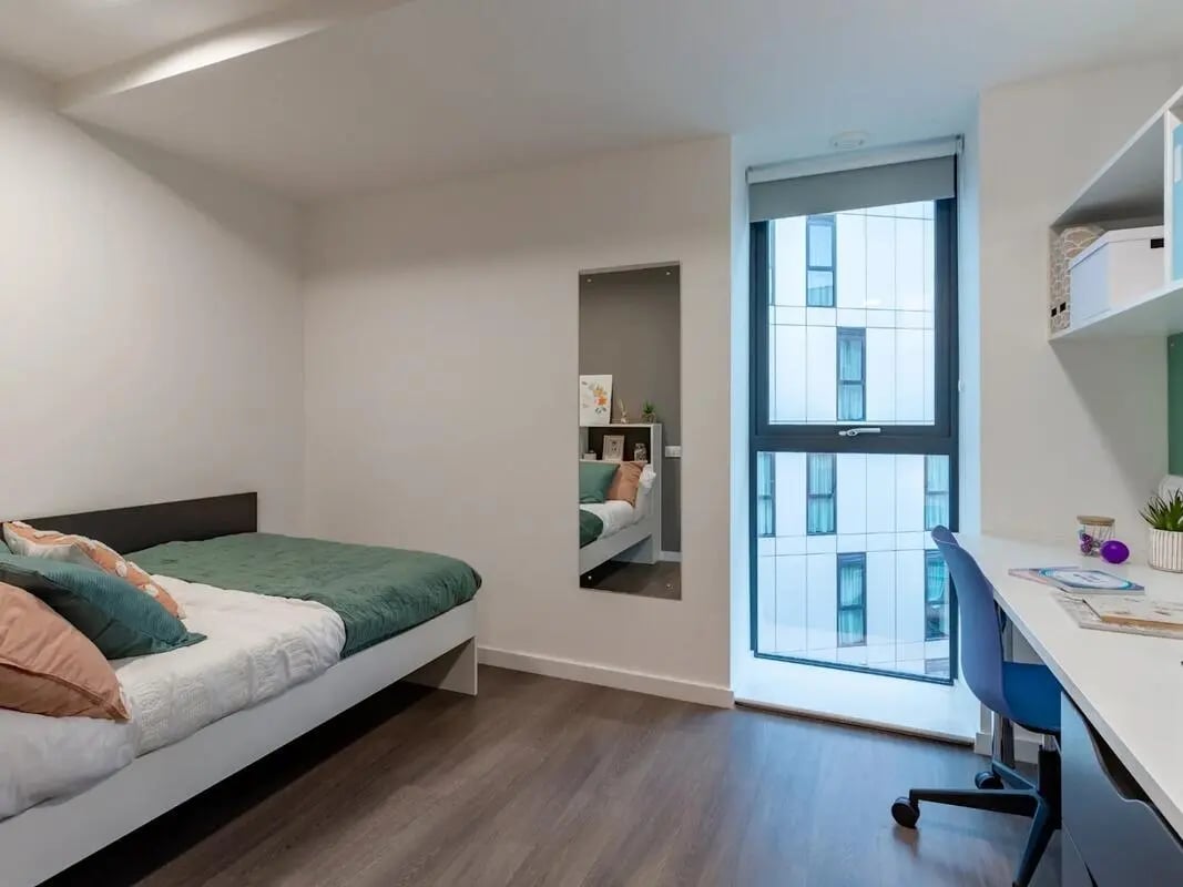 Bed desk chair and window bedroom at Pavilion Court London in London Student Accommodation