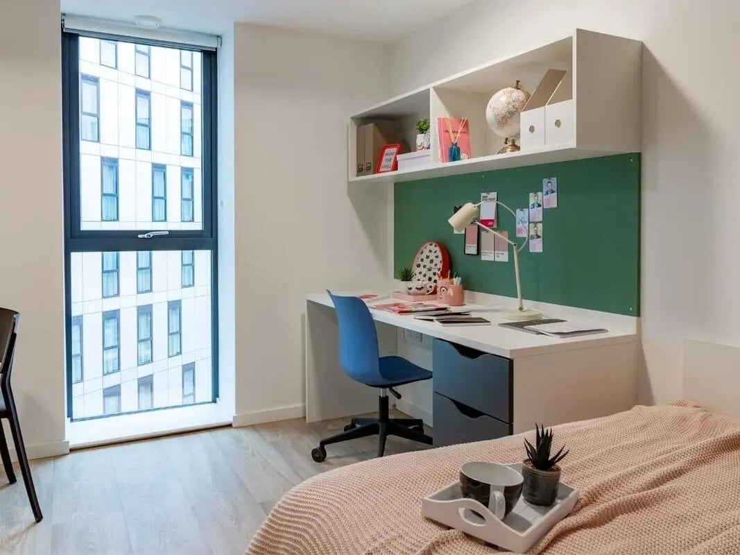 Desk chair lamp globe bed and tray bedroom at Pavilion Court London in London Student Accommodation