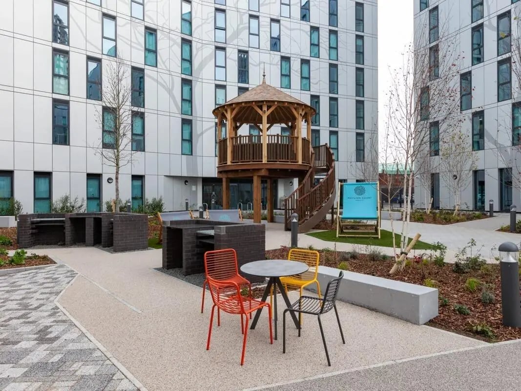Outdoor dining area with gazabo and buildings exterior at Pavilion Court London in London Student Accommodation