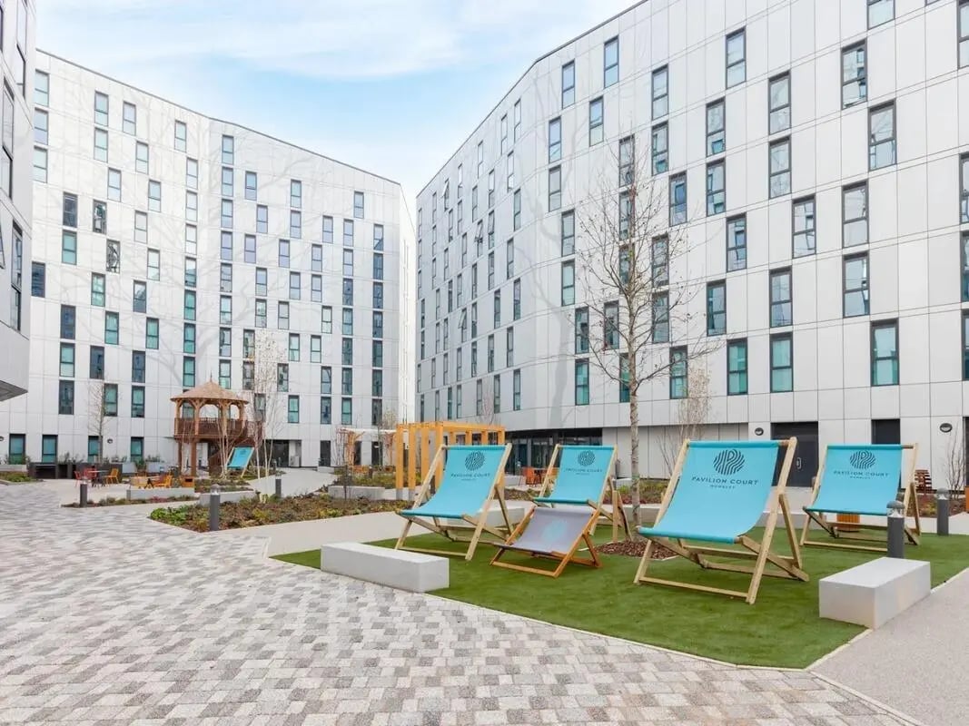 Courtyard with deck chairs and buildings exterior at Pavilion Court London in London Student Accommodation