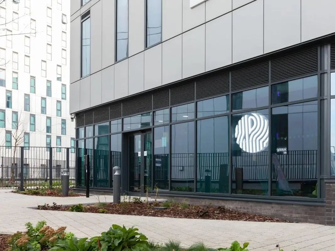 Modern building entrance with logo exterior. at Pavilion Court London in London Student Accommodation