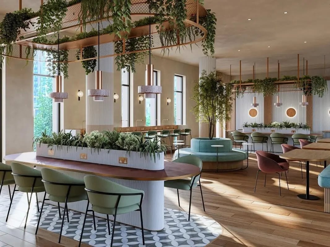 Chairs and tables with plants common area at Pavilion Court London in London Student Accommodation