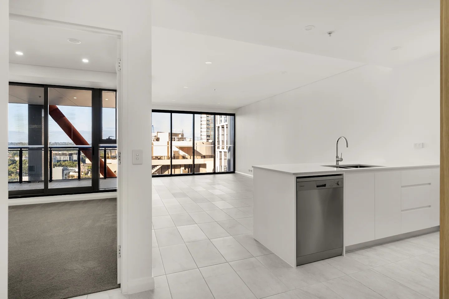 Modern kitchen with dishwasher and sink living area at UKO Parramatta Central in Sydney Student Accommodation