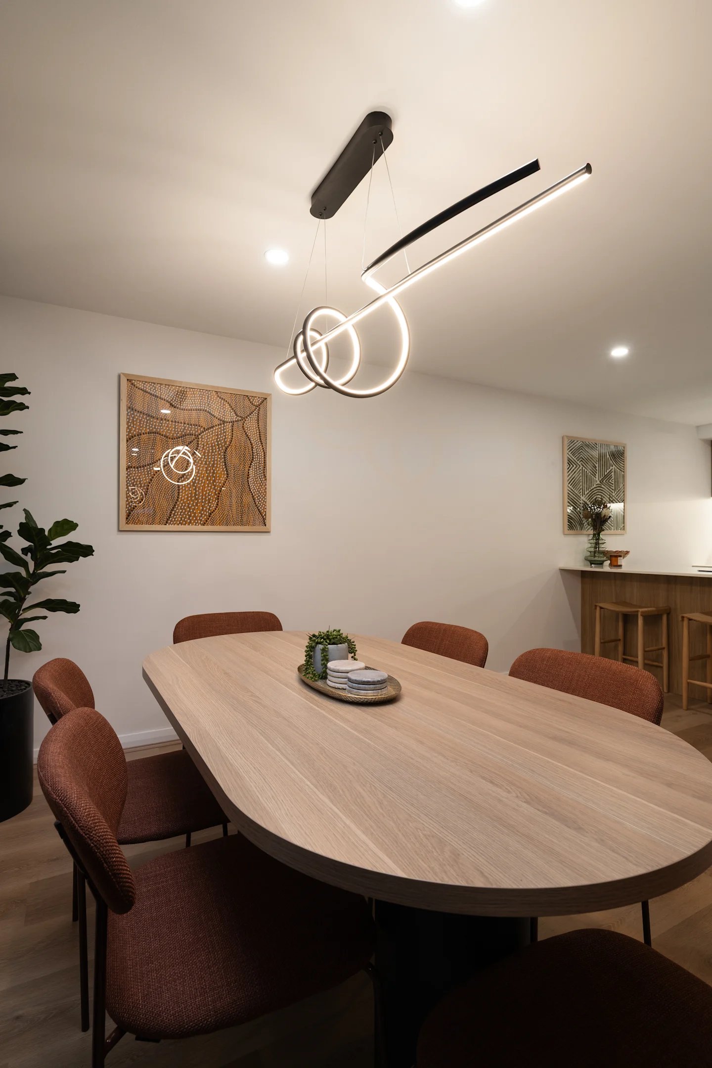 Oval table with chairs and bar stools dining area at UKO Parramatta Central in Sydney Student Accommodation