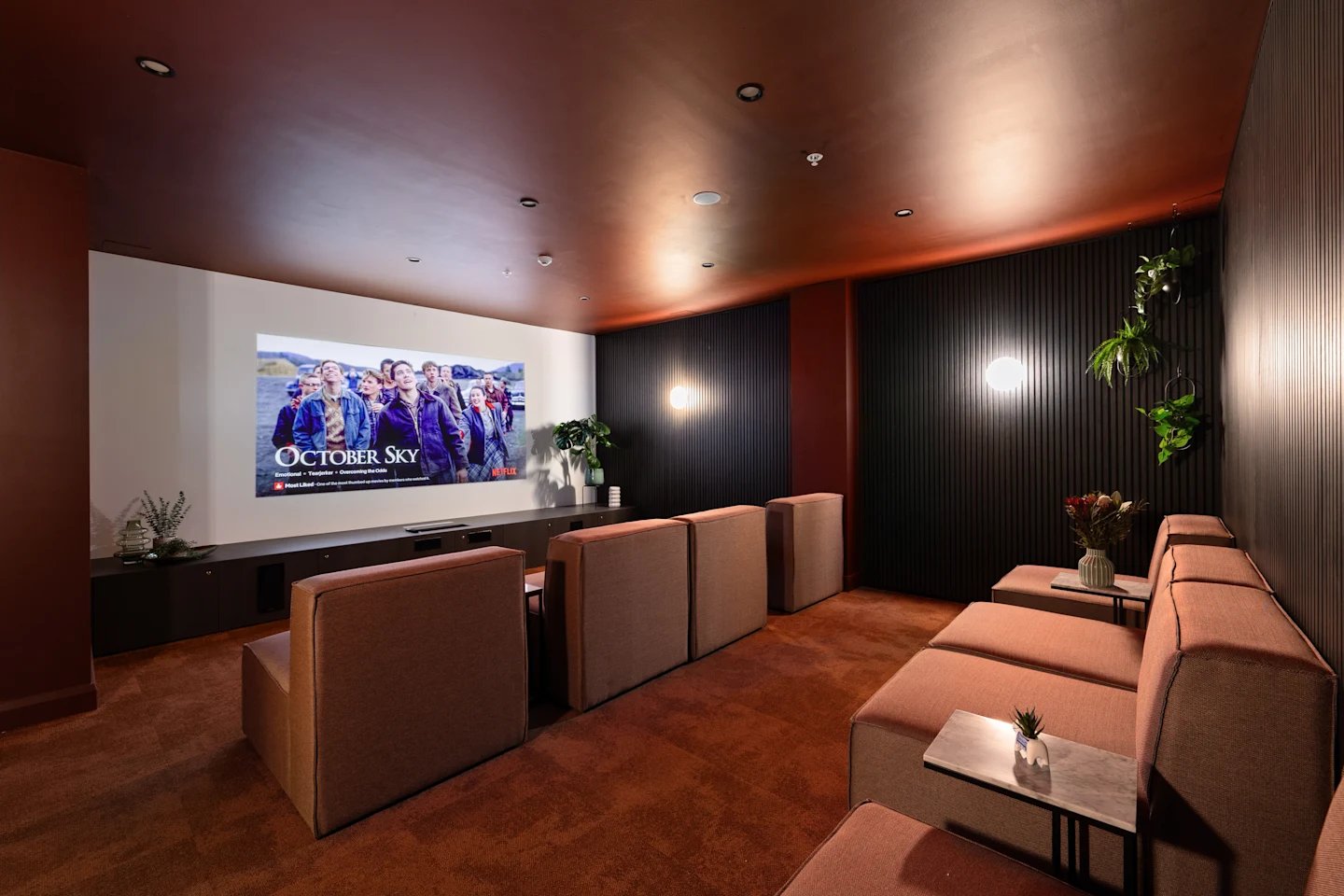 Cinema room with plush seating and screen at UKO Parramatta Central in Sydney Student Accommodation