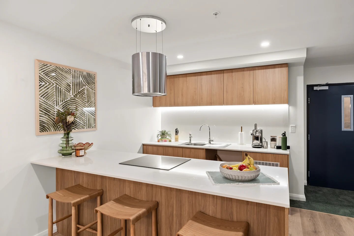 Island bar with stools modern cabinetry kitchen at UKO Parramatta Central in Sydney Student Accommodation