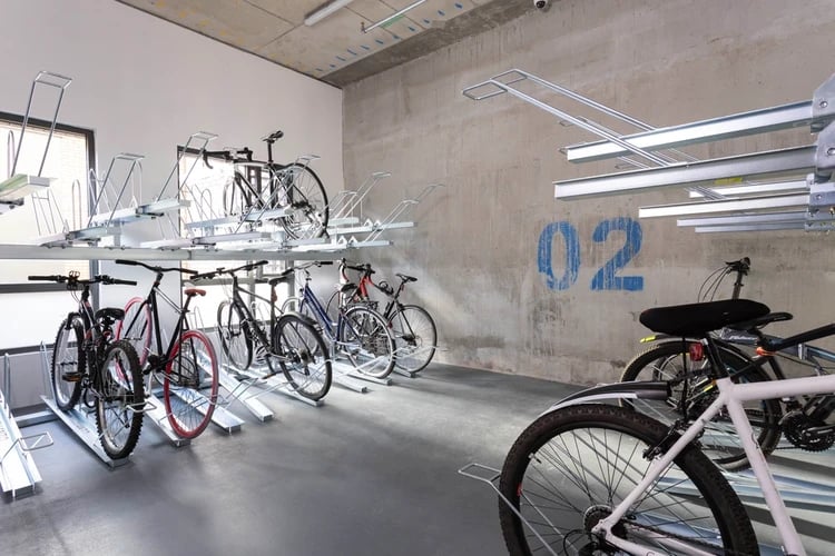 Bikes in multi-level racks storage area at Hayloft Point in London Student Accommodation