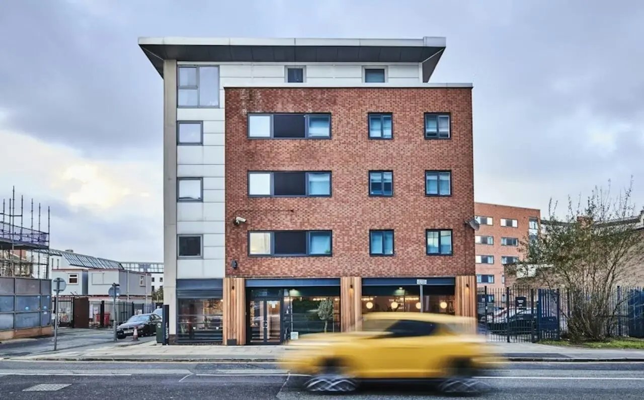 Modern brick building with many windows exterior at Capital Gate in Liverpool Student Accommodation