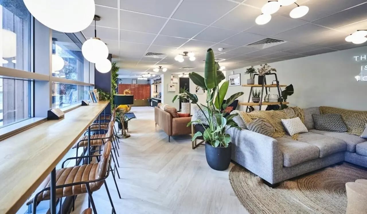 Bar seating sofa large plant living room at Capital Gate in Liverpool Student Accommodation
